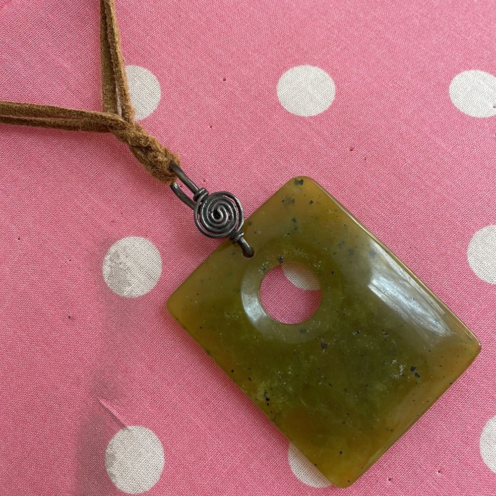 Leather and jade pendant with pewter swirl
